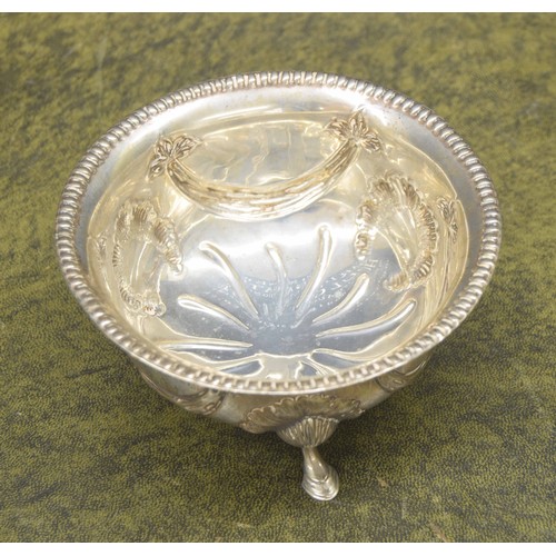 683 - Edward VII silver bowl, repousse decorated with swags with a reeded rim, raised on three s... 