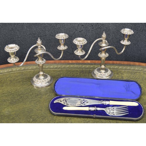 687 - Pair of silver plated twin-branch candelabra, 9