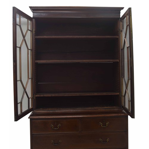 854 - Georgian mahogany library bookcase, with a stepped cornice over astragal glazed doors enclosing a sh... 