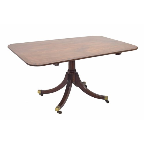 877 - Georgian mahogany tilt-top rectangular breakfast/dining table, the cross banded top hinged on a cent... 