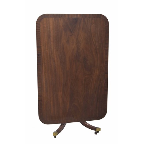 877 - Georgian mahogany tilt-top rectangular breakfast/dining table, the cross banded top hinged on a cent... 