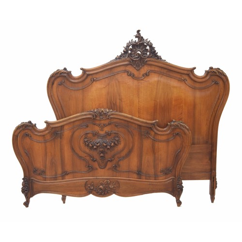 888 - Good French walnut carved bed frame, overall with carved scrolling foliate decoration, with side sup... 