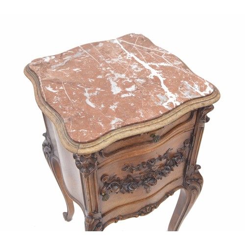 887 - French bedside pot cupboard, the serpentine  rouge marble top over a single drawer and carved applie... 