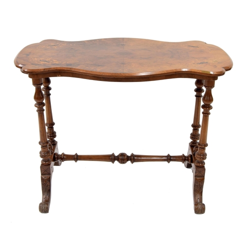 852 - Victorian figured walnut serpentine stretcher table, the inlaid top upon turned supports united by a... 