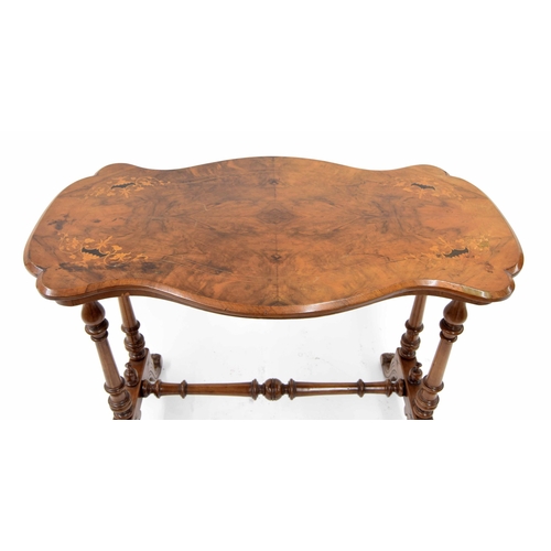 852 - Victorian figured walnut serpentine stretcher table, the inlaid top upon turned supports united by a... 