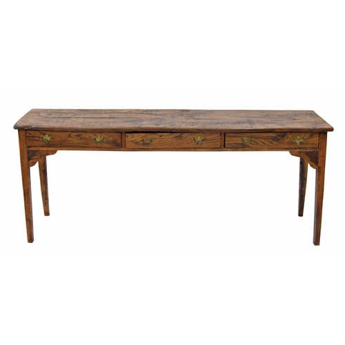 883 - Provincial French elm serving table, the plank top over three short drawers raised on square taperin... 