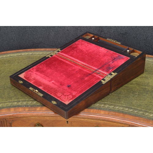 642 - Victorian rosewood writing slope, the hinged top with mother of pearl plaque and escutcheon, enclosi... 