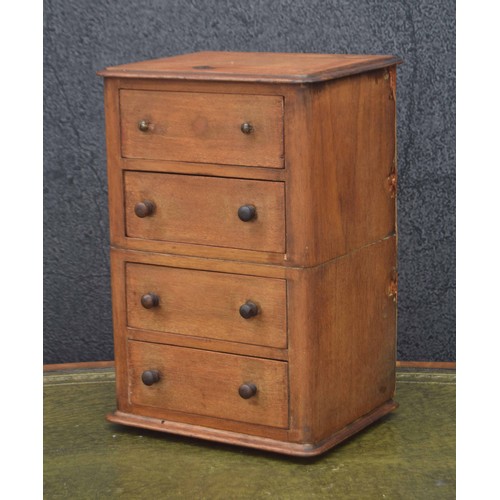 666 - Mahogany apprentice chest of four drawers, with a selection of interesting contents, 10