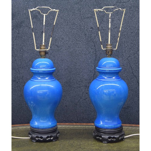 745 - Pair of decorative Chinese blue crackle glaze urn table lamps mounted upon pieced stands, 16