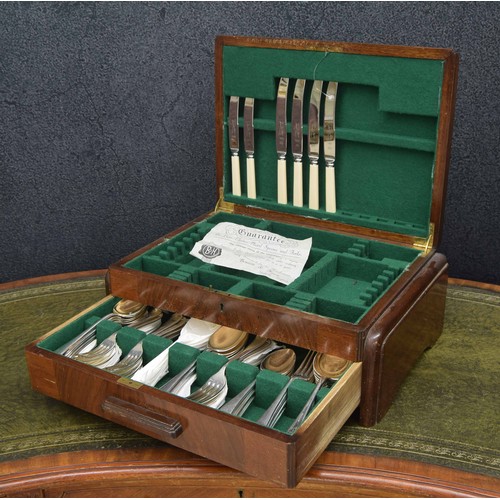 658 - Walnut veneered cutlery canteen, containing some plated cutlery (incomplete), key