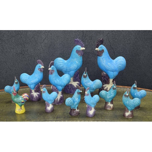 756 - Selection of blue and aubergine glazed cockerel figures, tallest 14