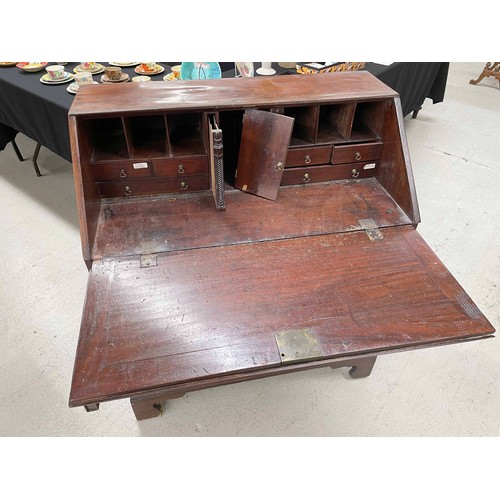 892 - Georgian mahogany bureau, the hinged fall front enclosing a divided stationary interior with drawers... 