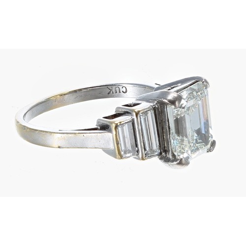 359 - Fine 18ct white gold emerald and baguette-cut ring in a stepped setting, the emerald-cut diamond 1.9... 