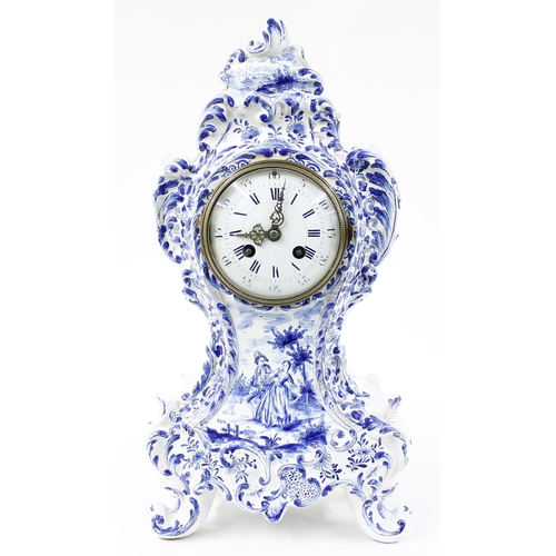 1517 - Dutch blue and white pottery balloon shaped two train mantel clock, the S. Marti movement striking o... 