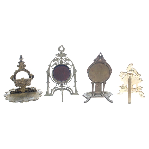 627 - Four gilt metal pocket watch stands, the tallest 6.75'' high approx (4)