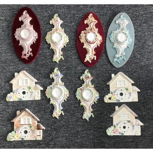 633 - Six various painted porcelain rococo cartouche watch holders, 9