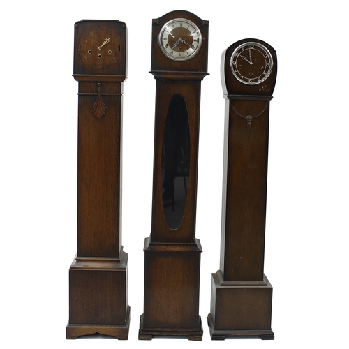 1827 - Oak three train granddaughter clock playing Westminster chimes on six rods, the movement backplate i... 