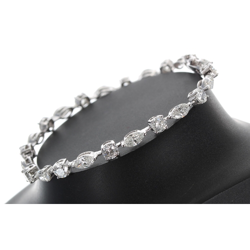 130 - Fine quality 18ct white gold diamond line bracelet, set with alternate round brilliant cut and marqu... 