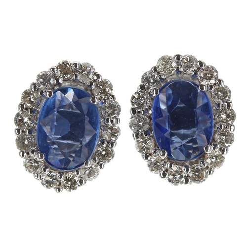 180 - Attractive pair of modern 18ct white gold oval sapphire and round brilliant cut diamond cluster stud... 