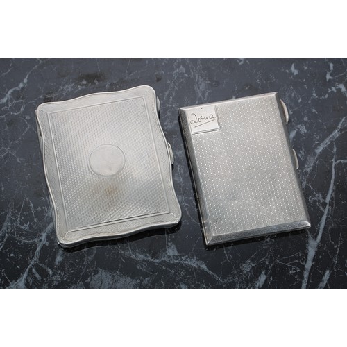 518 - Two silver engine turned cigarette cases, the first of serpentine form with gilt interior, Birmingha... 