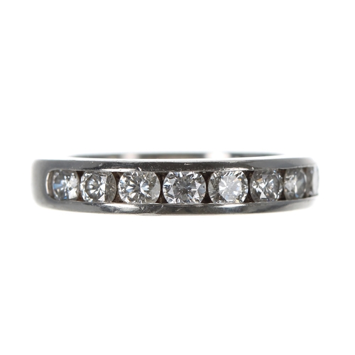 247 - Tiffany & Co. platinum diamond half eternity ring, channel set with nine brilliant-cut diamonds ... 