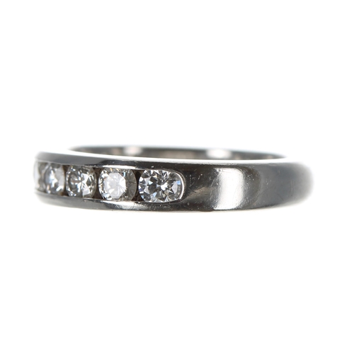 247 - Tiffany & Co. platinum diamond half eternity ring, channel set with nine brilliant-cut diamonds ... 