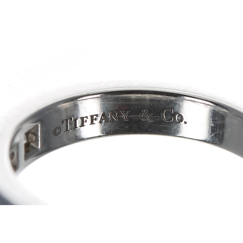 247 - Tiffany & Co. platinum diamond half eternity ring, channel set with nine brilliant-cut diamonds ... 