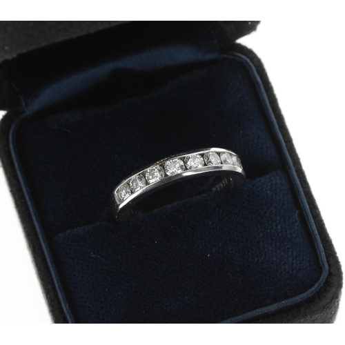 247 - Tiffany & Co. platinum diamond half eternity ring, channel set with nine brilliant-cut diamonds ... 