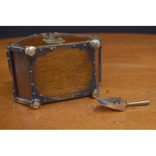 552 - Miniature novelty oak tea caddy, modelled as a coal scuttle with a silver plated handle, mounts, lin... 