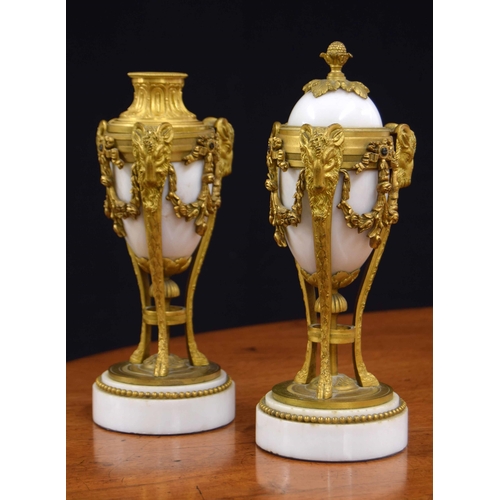 559 - Pair of Louis XVI style gilt mounted marble cassolette/candlesticks, the combination tops alternatin... 