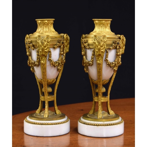 559 - Pair of Louis XVI style gilt mounted marble cassolette/candlesticks, the combination tops alternatin... 