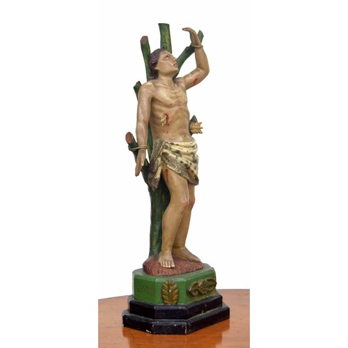 579 - 18th century Colonial carved figure of St Sebastian, the patron saint of archers and athletes, 26