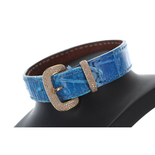 404 - Blue leather leather bracelet with an 18ct pavé diamond buckle, 11gm, 8.5