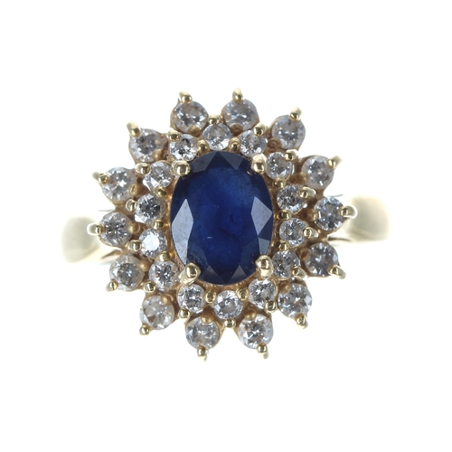 408 - 18ct sapphire and diamond oval cluster ring, the sapphire 1.50ct approx, in a two row setting of rou... 