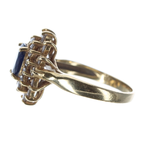 408 - 18ct sapphire and diamond oval cluster ring, the sapphire 1.50ct approx, in a two row setting of rou... 