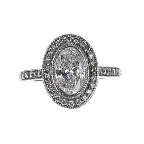 192 - Attractive oval brilliant-cut diamond cluster ring, the centre stone 1.05ct approx, clarity SI2, col... 