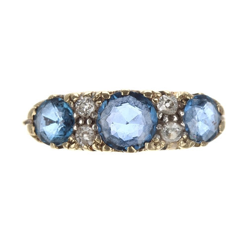 194 - 18ct yellow gold scroll set sapphire and diamond ring, with three sapphires and four old-cut diamond... 