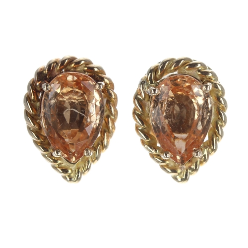 209 - Pair of 18ct yellow gold hessonite garnet pear shaped stud earrings in a rope twist setting, stud po... 