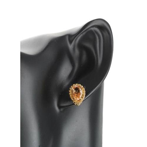 209 - Pair of 18ct yellow gold hessonite garnet pear shaped stud earrings in a rope twist setting, stud po... 