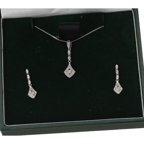 105 - Modern 9ct white gold diamond pendant and earring set, 3gm, the pendant 24mm, the earrings with post... 