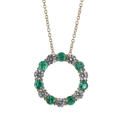 166 - Attractive 18ct yellow gold emerald and diamond circular pendant on chain designed by Luke Stockley ... 