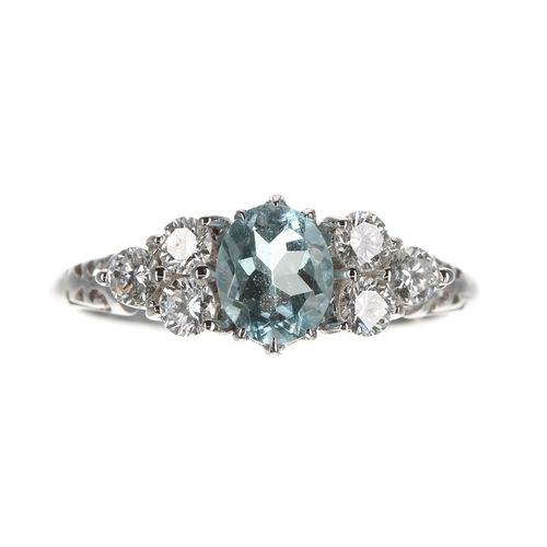 178 - 18ct white gold aquamarine and diamond cluster ring, the oval aquamarine 0.50ct approx, with three r... 