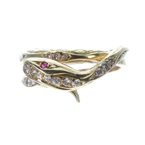 255 - Unusual 18ct yellow gold snake design ring, with ruby set eyes and diamonds to the head and body, 6.... 