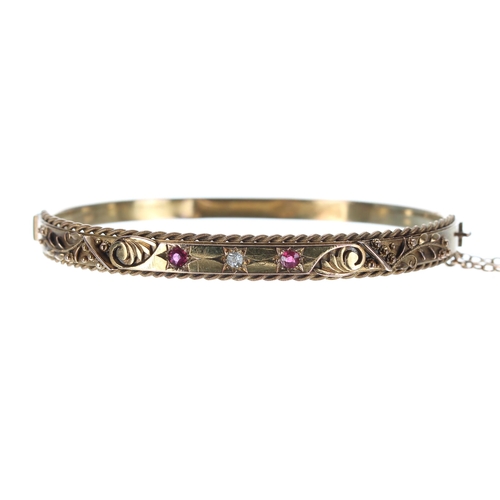 106 - Victorian 15ct ruby and diamond three stone bangle, width 6mm, with safety chain, 8.4gm... 