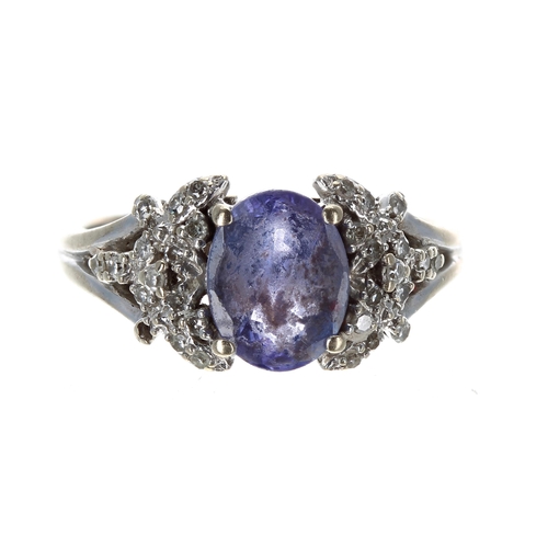 221 - 18ct white gold tanzanite and diamond dress ring, the tanzanite 1.60ct approx, width 10mm, 4.7gm, ri... 