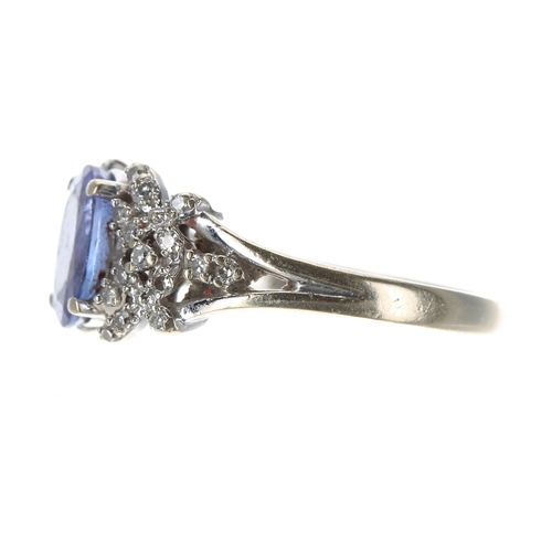 221 - 18ct white gold tanzanite and diamond dress ring, the tanzanite 1.60ct approx, width 10mm, 4.7gm, ri... 