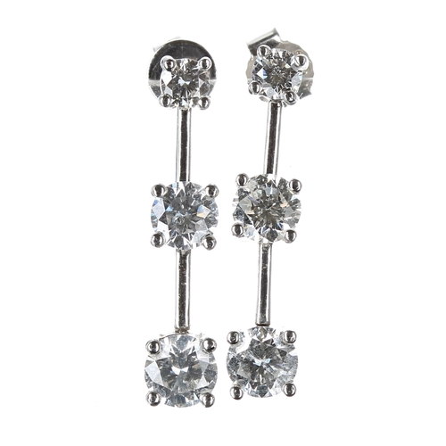 137 - Good pair of 18ct white gold trilogy diamond drop earrings, each with three graduating round brillia... 