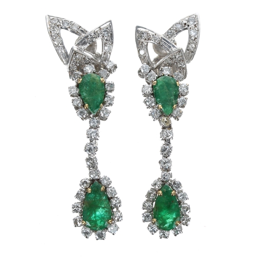 167 - Attractive pair of white gold emerald and diamond drop earrings, each set with two pear shaped emera... 