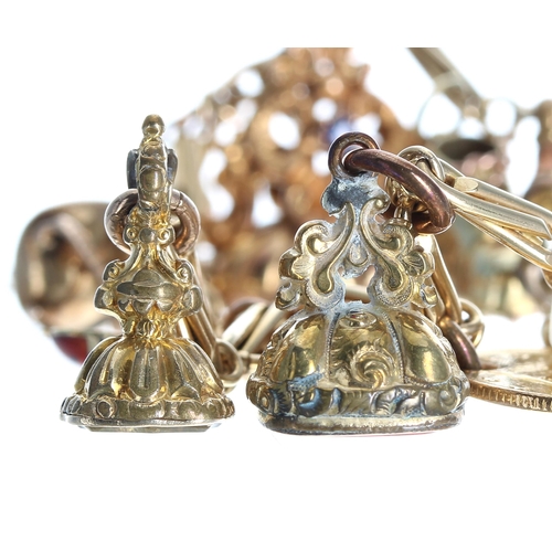 259 - Yellow metal cable link bracelet with an assortment of 9ct and 14ct gold and gilded charms and fobs,... 