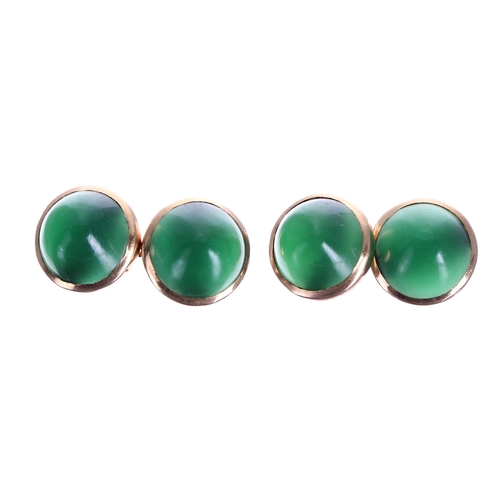 264 - Pair of cabouchon jade gold mounted cufflinks, 6.7gm, 11mm diameter